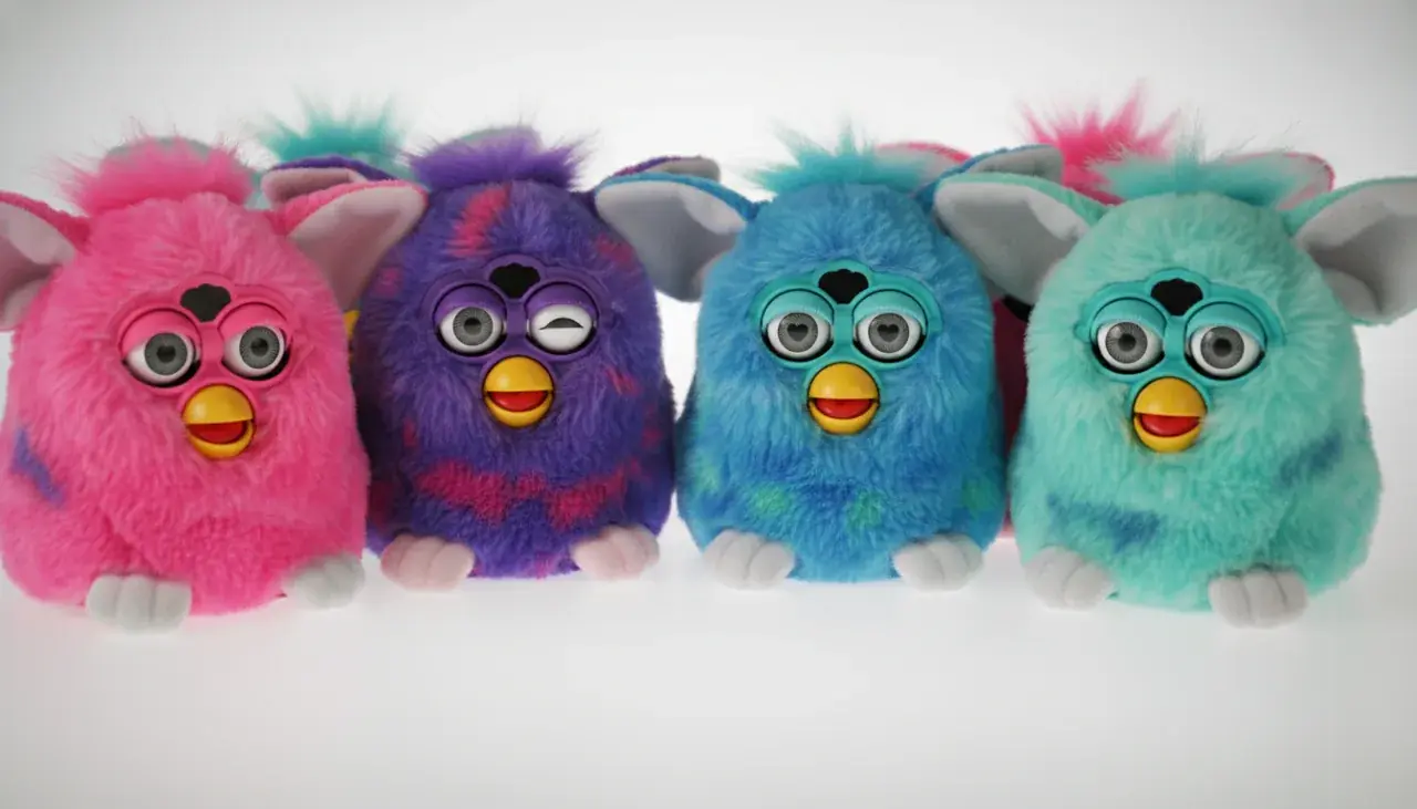 colorful furby toys displayed together showing different personalities and colors