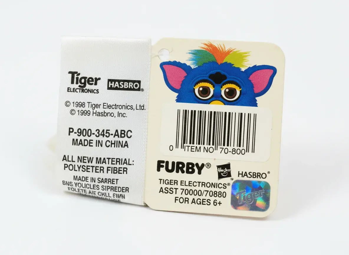 Close-up of authentic Furby tag and markings showing verification details