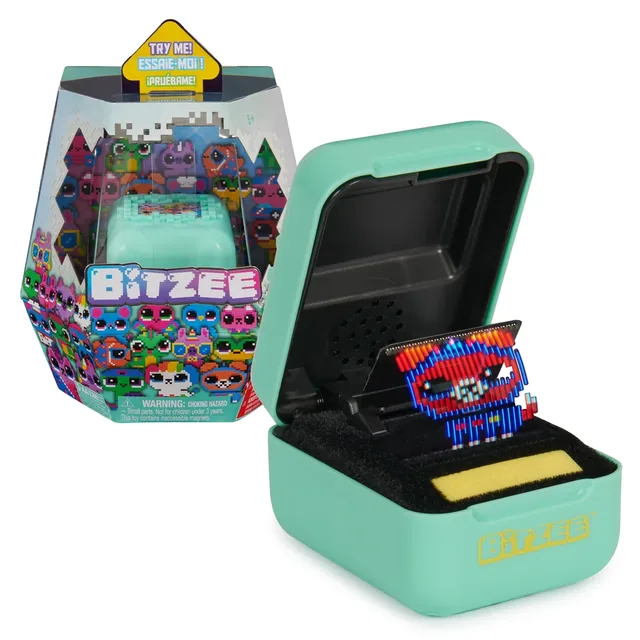 Mint-green Bitzee digital pet case with its packaging and a virtual animal displayed inside